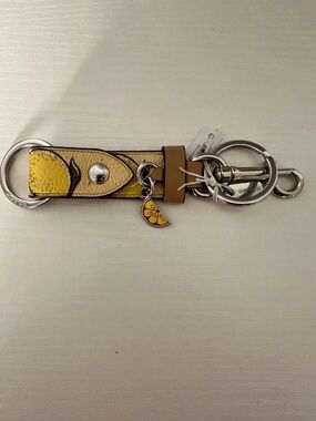 NWT Coach CAO47 Trigger Snap Bag Charm With Lemon Print — Silver/Multi